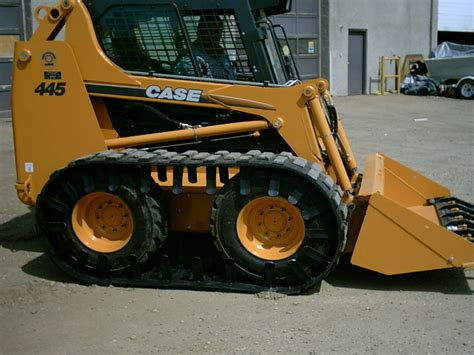 mustang skid steer over tire tracks|over the tire skid steer track.